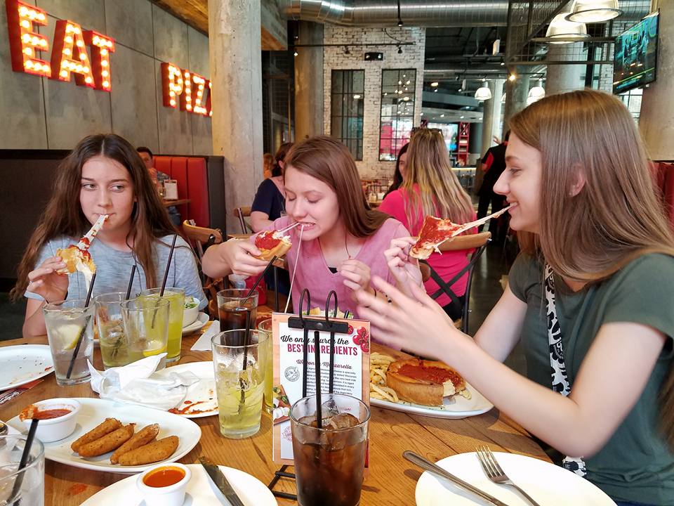 My nieces eating Giordano's Pizza in the Windy City on our family trip to Chicago