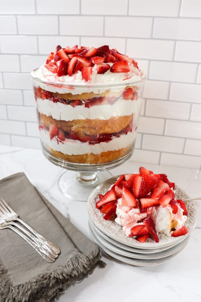 trifle bowl and plate with strawberry dessert