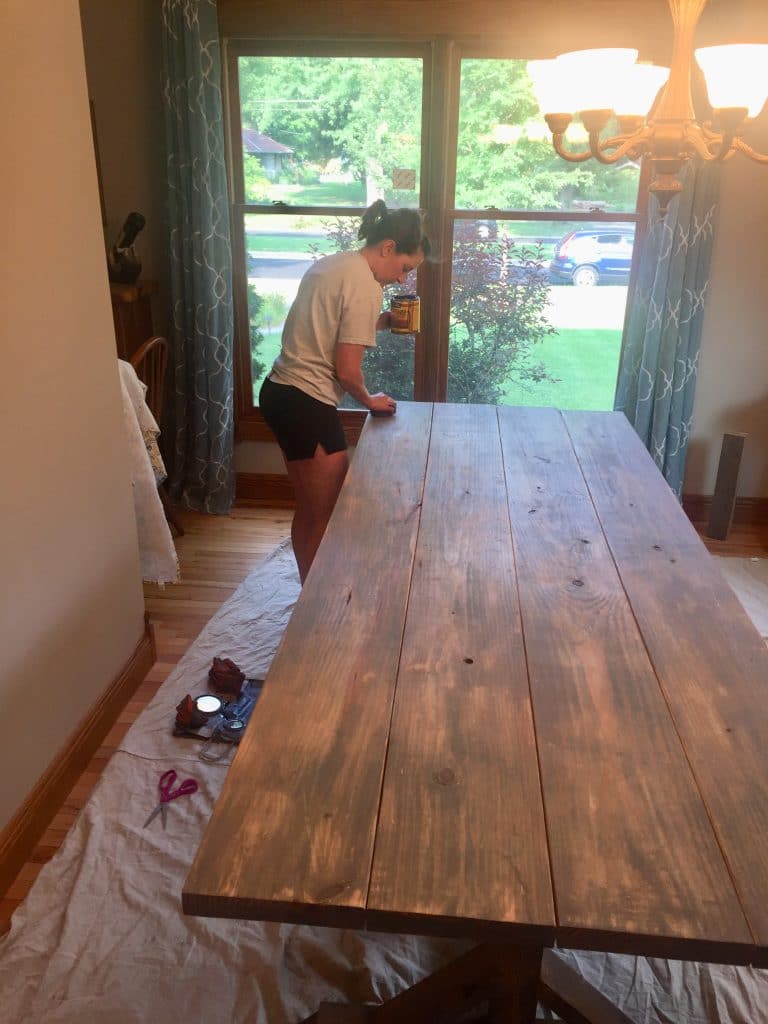 Rubbing stain on the homemade table.