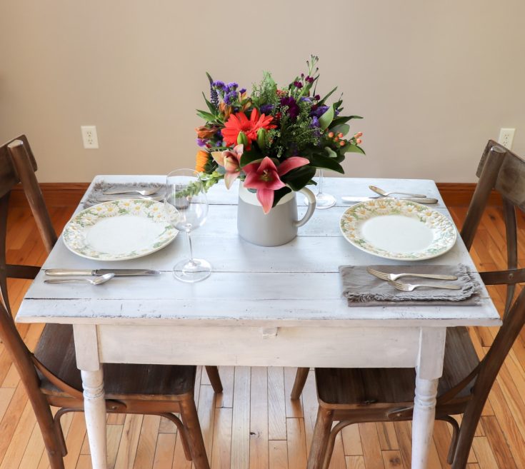 white table with place setting for two
