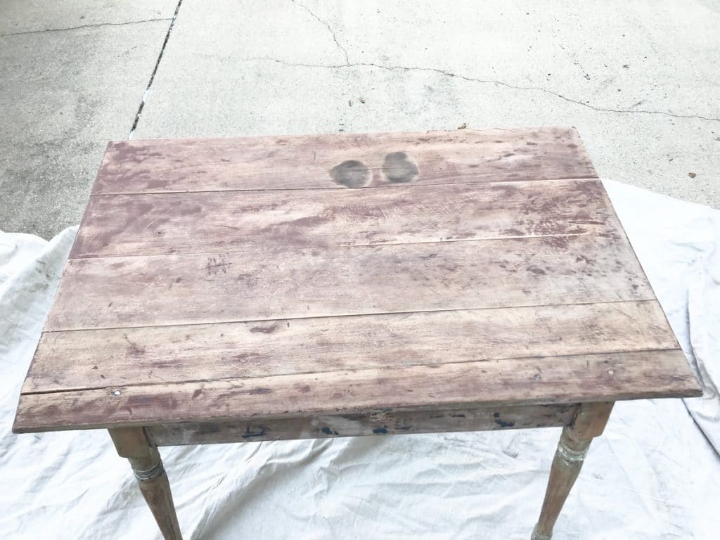 table after being stripped of blue paint
