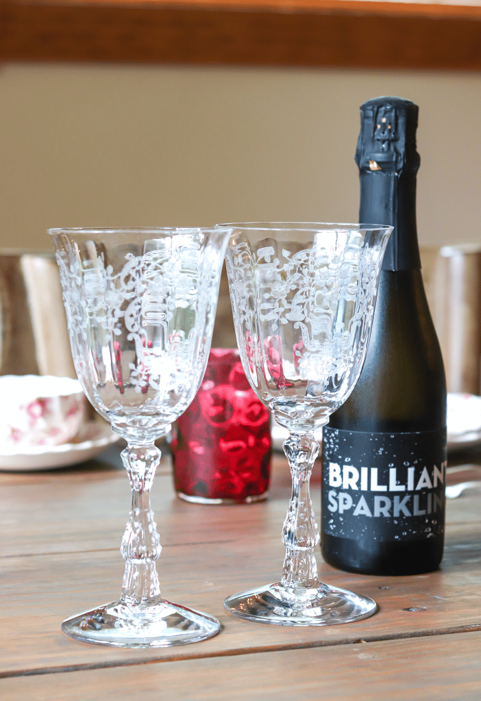 Crystal glassware with a bottle of champagne