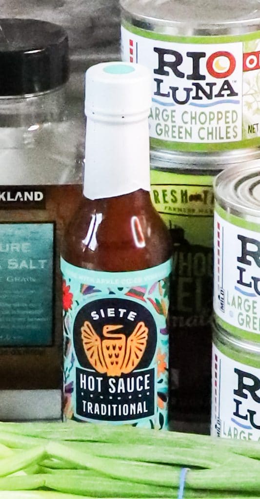 Siete hot sauce sitting among the other ingredients