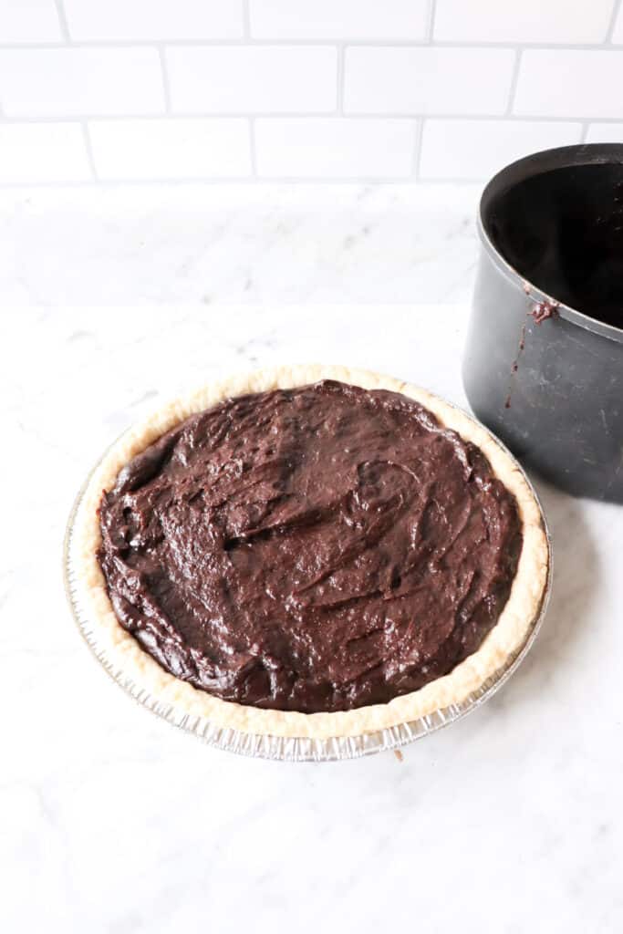 Chocolate pie filling in pie crust.