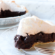 Slice of Old Fashioned Chocolate Meringue Pie sitting on a clear plate.