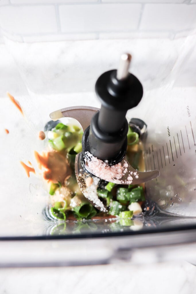 All ingredients in a blender before being blended.