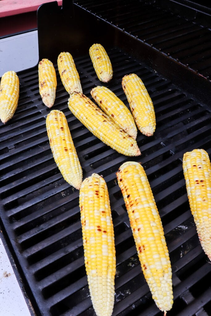 Corn on the grill just starting to roast.