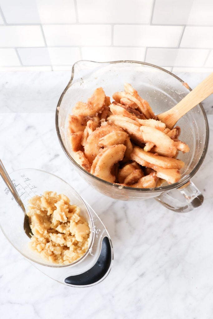 Apple filling in one bowl and crumble topping in another.